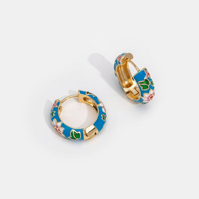 Boucles d’oreilles cercles dorées à fleur